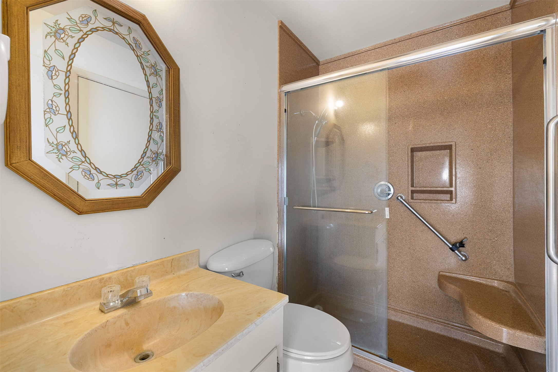 809 Main Street Lexington, TX 78947 - Photo 19 of 23 a bathroom with a sink toilet and shower