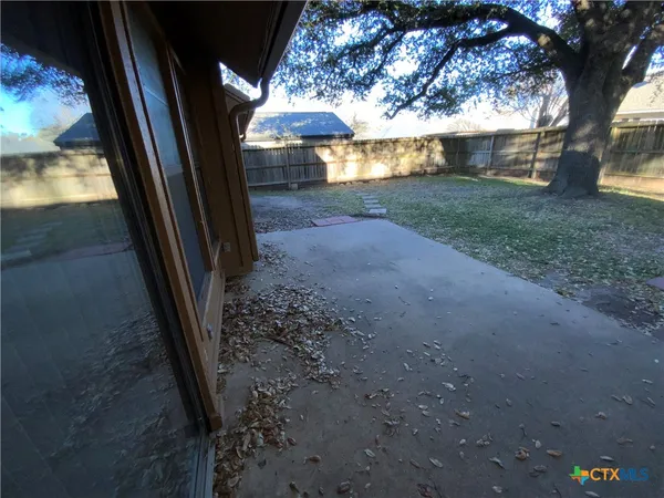 a view of backyard with green space