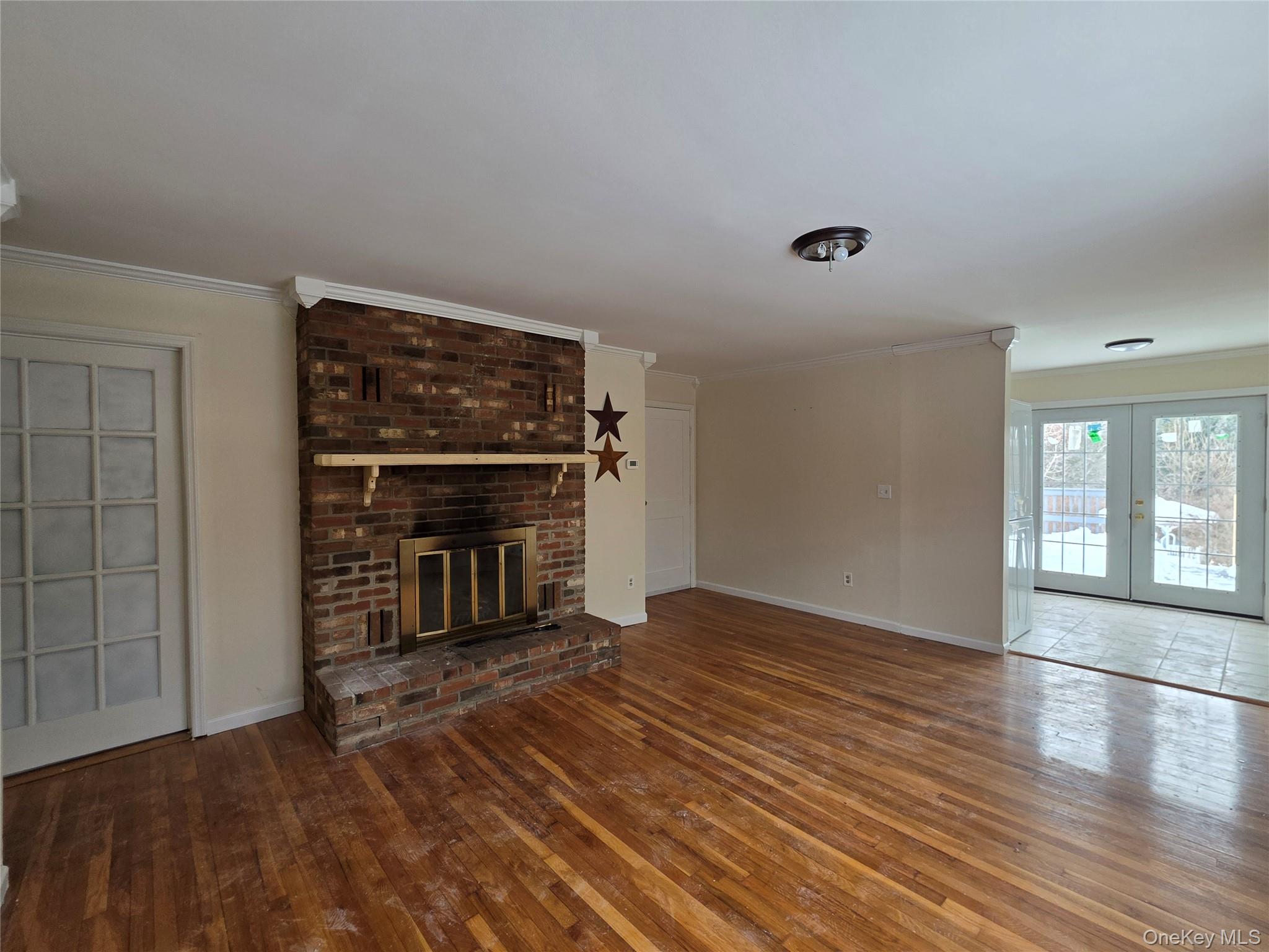 234 Prospect Road, Unit 2 Monroe, NY 10950 - Photo 13 of 19 a view of an empty room with a fireplace and a window
