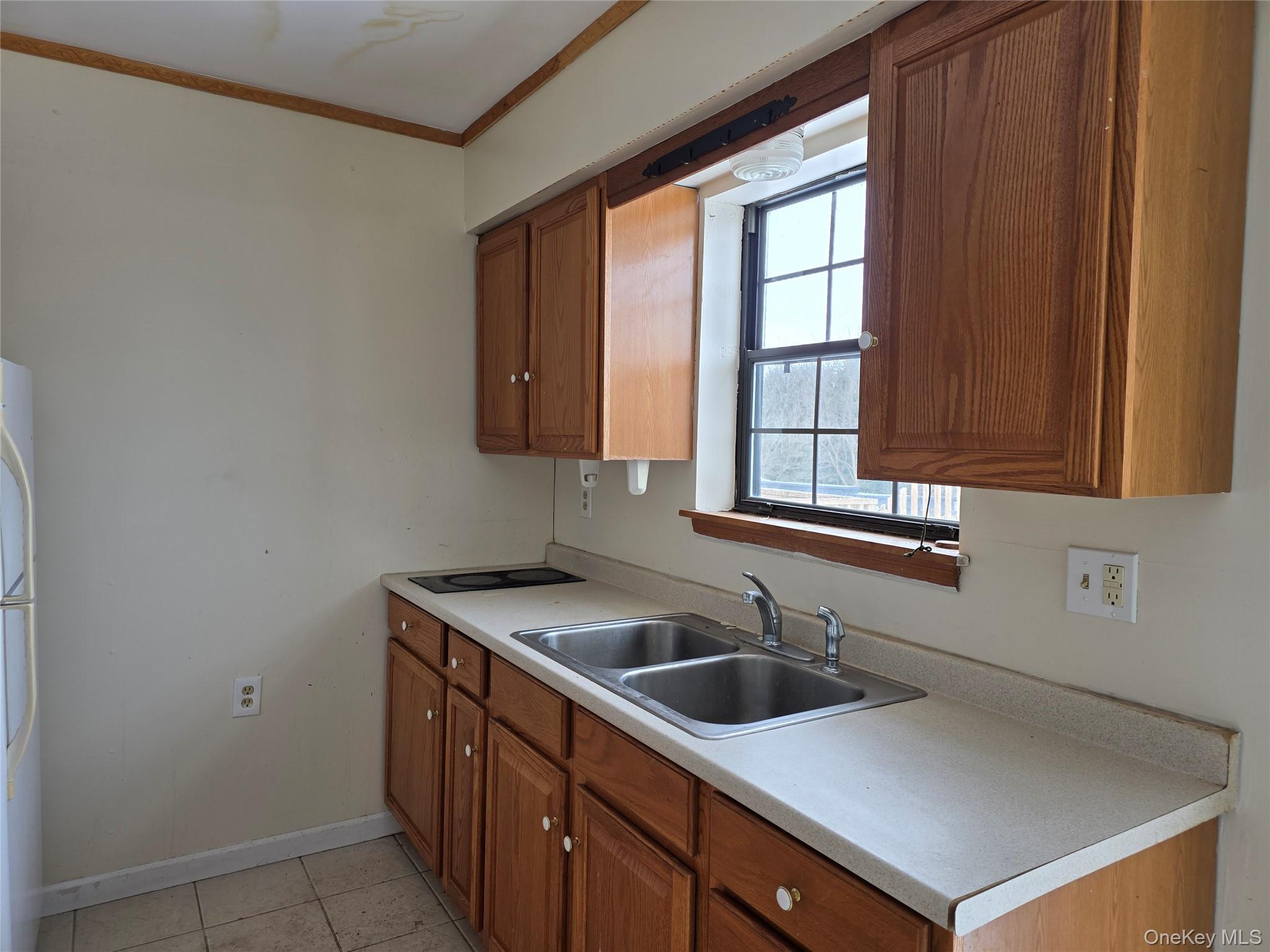 234 Prospect Road, Unit 2 Monroe, NY 10950 - Photo 17 of 19 a kitchen with a sink cabinets and window