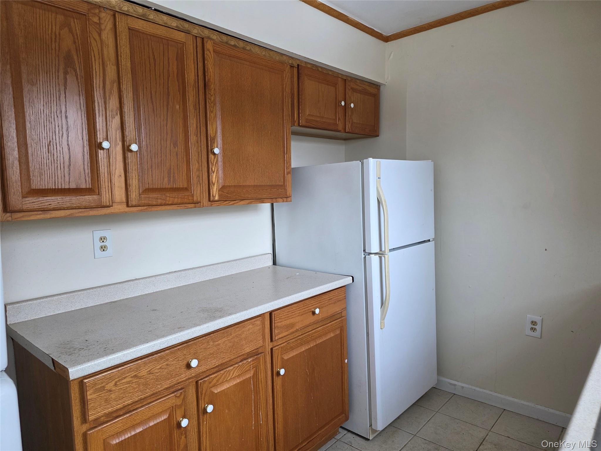 234 Prospect Road, Unit 2 Monroe, NY 10950 - Photo 18 of 19 a kitchen with a refrigerator and cabinets