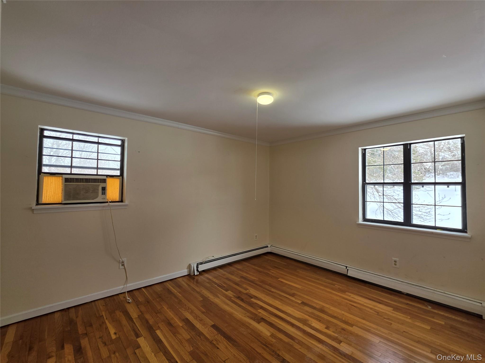 234 Prospect Road, Unit 2 Monroe, NY 10950 - Photo 10 of 19 a view of an empty room with wooden floor and a window