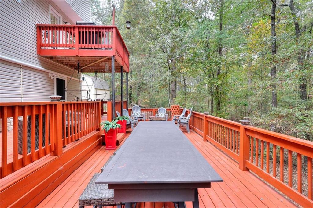738 Worth Court Bethlehem, GA 30620 - Photo 13 of 43 a view of balcony with wooden floor and outdoor seating
