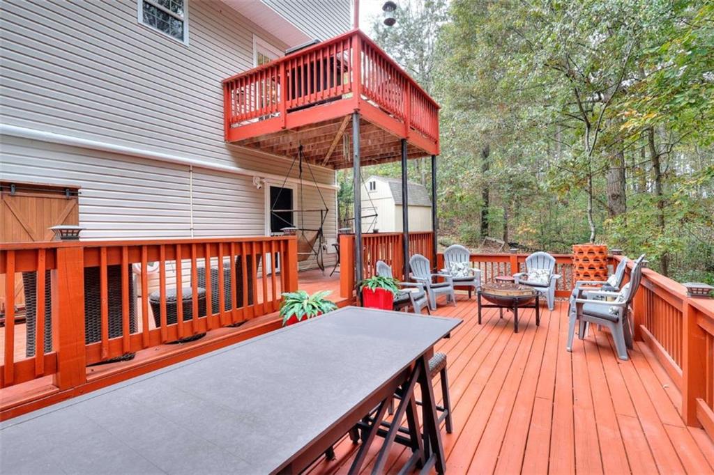 738 Worth Court Bethlehem, GA 30620 - Photo 14 of 43 an outdoor sitting area with furniture and wooden floor