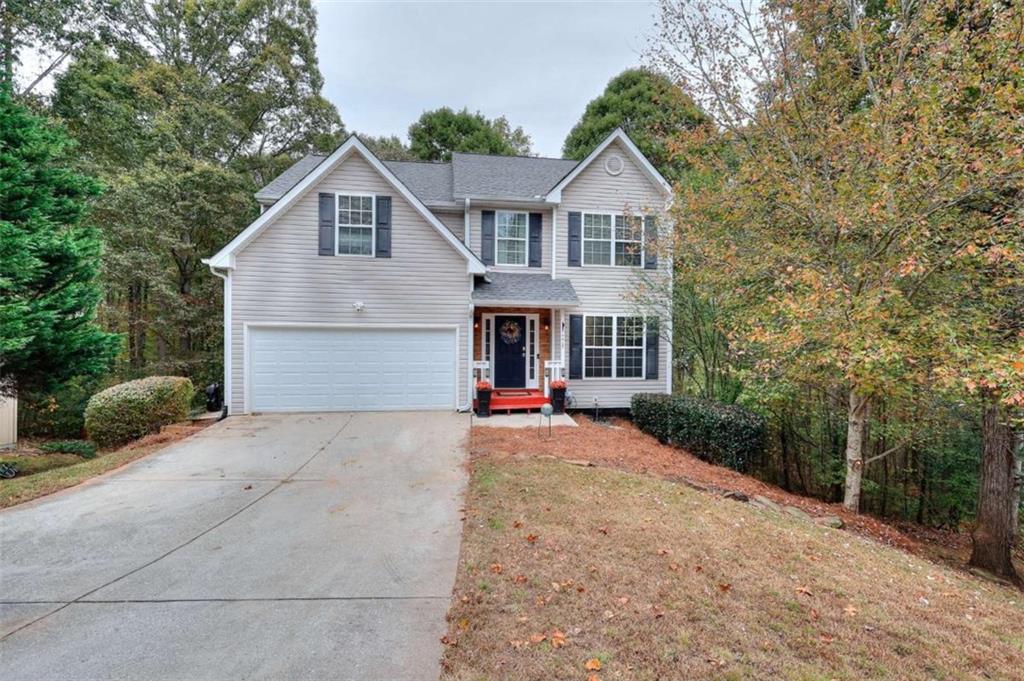 738 Worth Court Bethlehem, GA 30620 - Photo 31 of 43 a front view of a house with yard and trees in the background