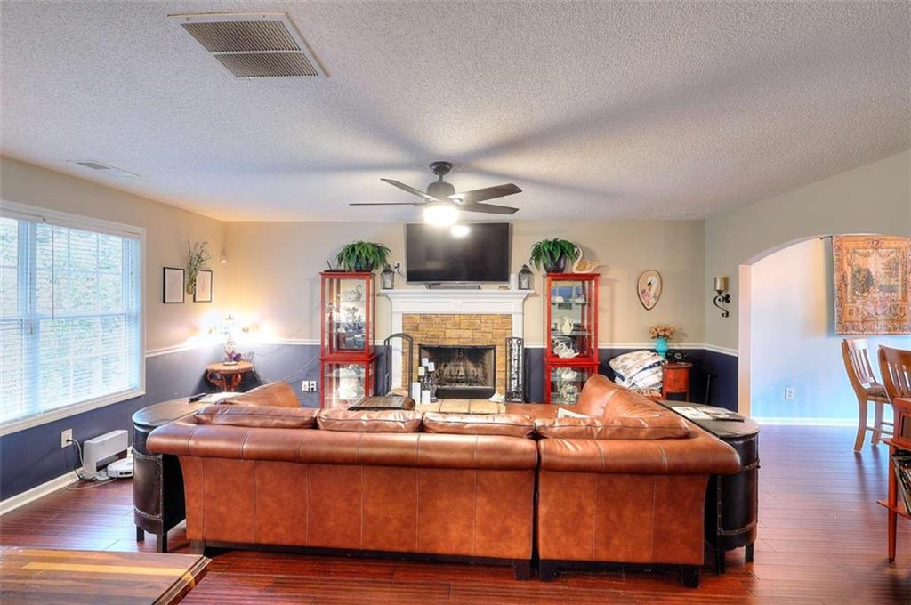 738 Worth Court Bethlehem, GA 30620 - Photo 5 of 43 a living room with fireplace furniture and a fireplace