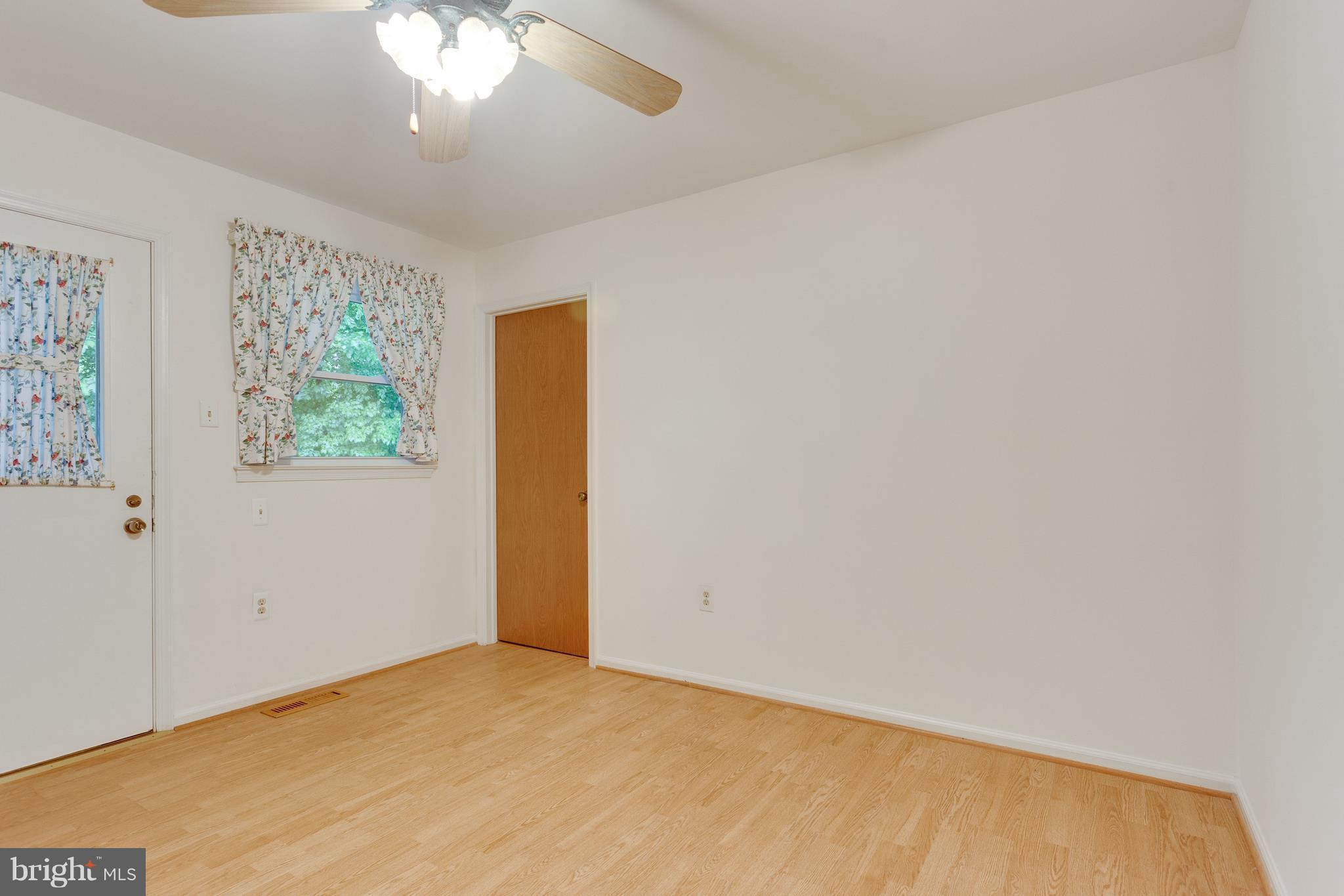 9156 Rockefeller Lane Springfield, VA 22153 - Photo 13 of 30 a view of an empty room with a window