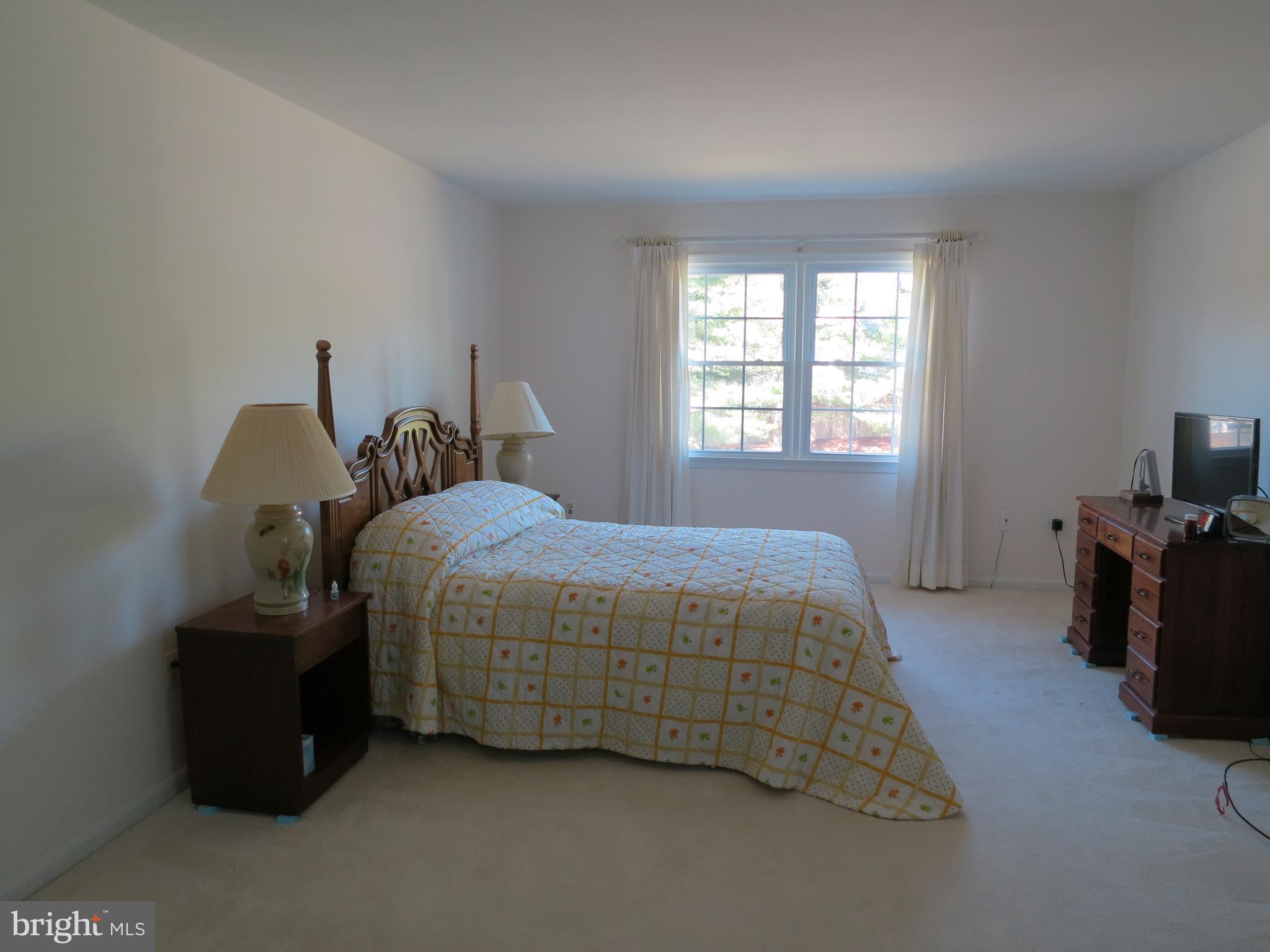 9156 Rockefeller Lane Springfield, VA 22153 - Photo 20 of 30 a bedroom with a bed and a tv