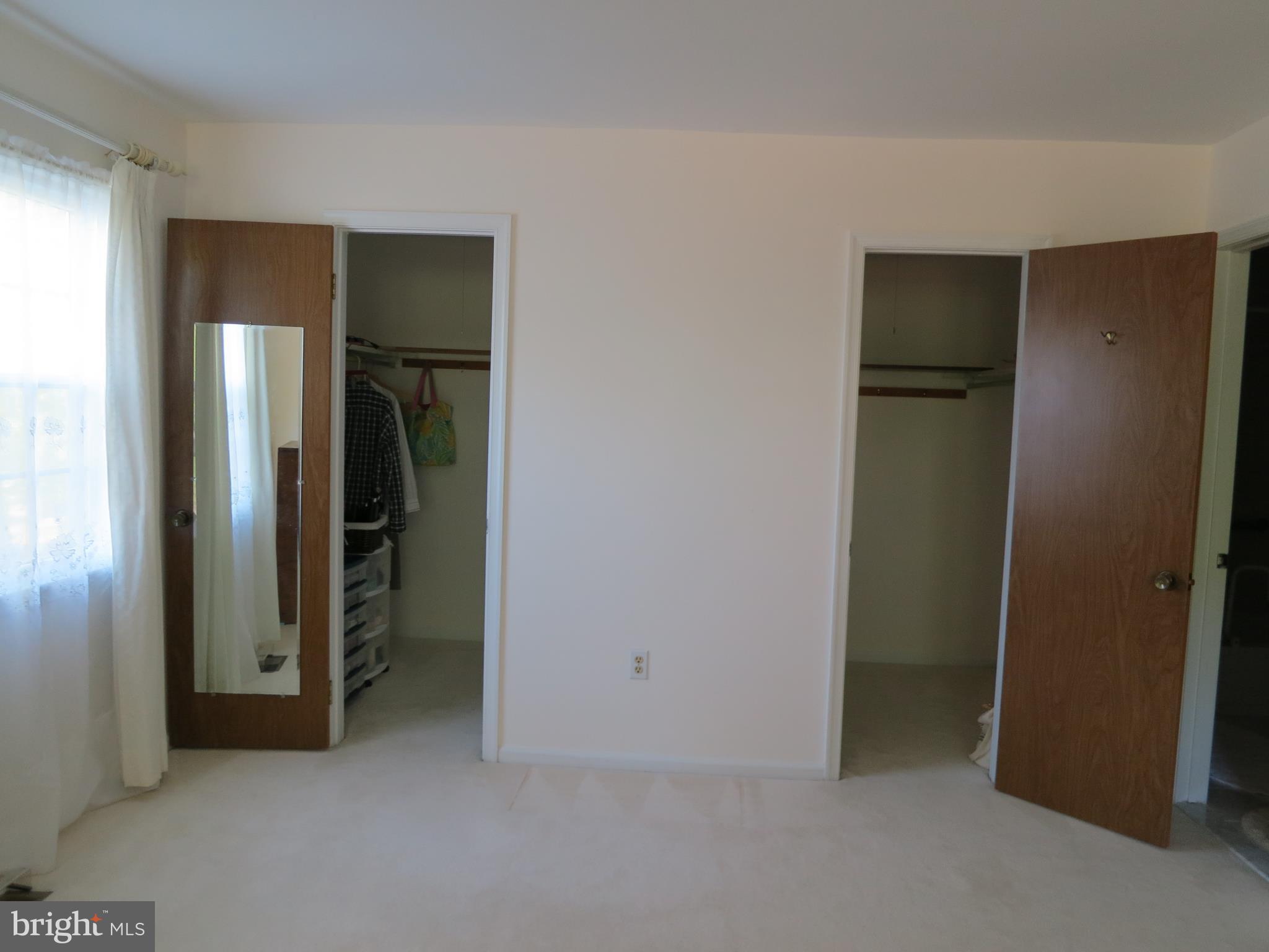 9156 Rockefeller Lane Springfield, VA 22153 - Photo 22 of 30 an empty room with closet and a bathroom