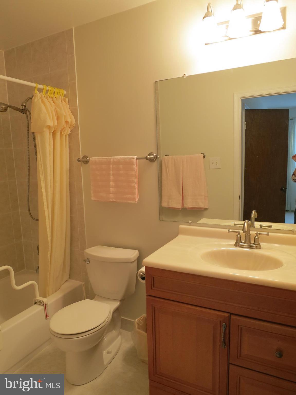 9156 Rockefeller Lane Springfield, VA 22153 - Photo 23 of 30 a bathroom with a sink toilet and shower