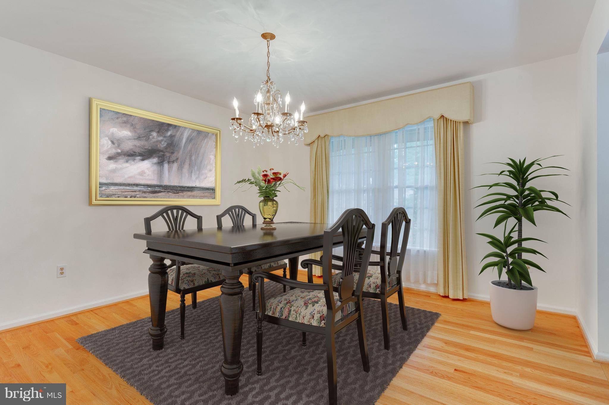 9156 Rockefeller Lane Springfield, VA 22153 - Photo 5 of 30 a view of a dining room with furniture and wooden floor