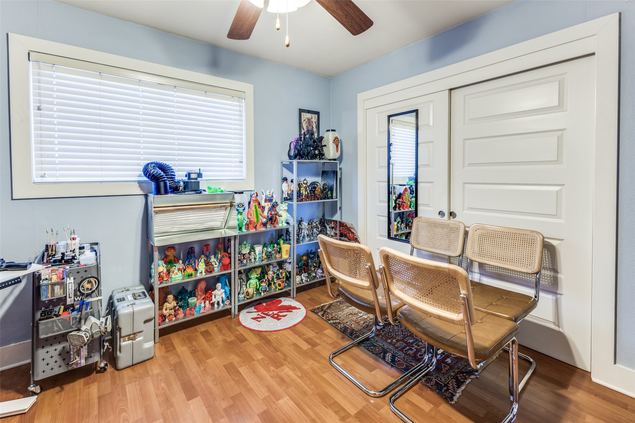 3815 Guadalupe Street, Unit 305 Austin, TX 78751 - Photo 16 of 27 a workspace with furniture and wooden floor