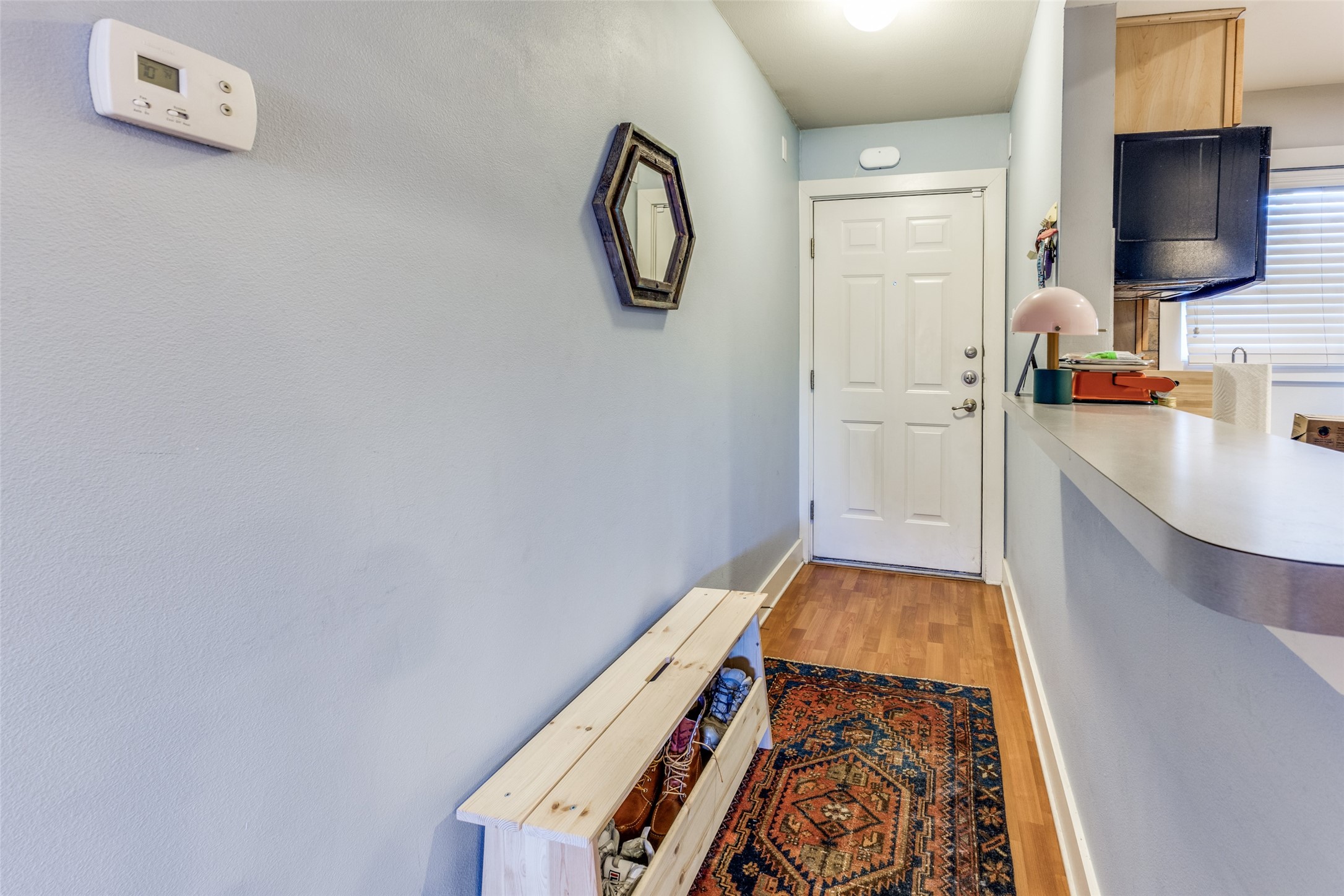 3815 Guadalupe Street, Unit 305 Austin, TX 78751 - Photo 2 of 27 a bathroom with a sink and a mirror
