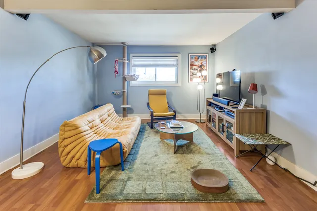 a room with furniture and wooden floor