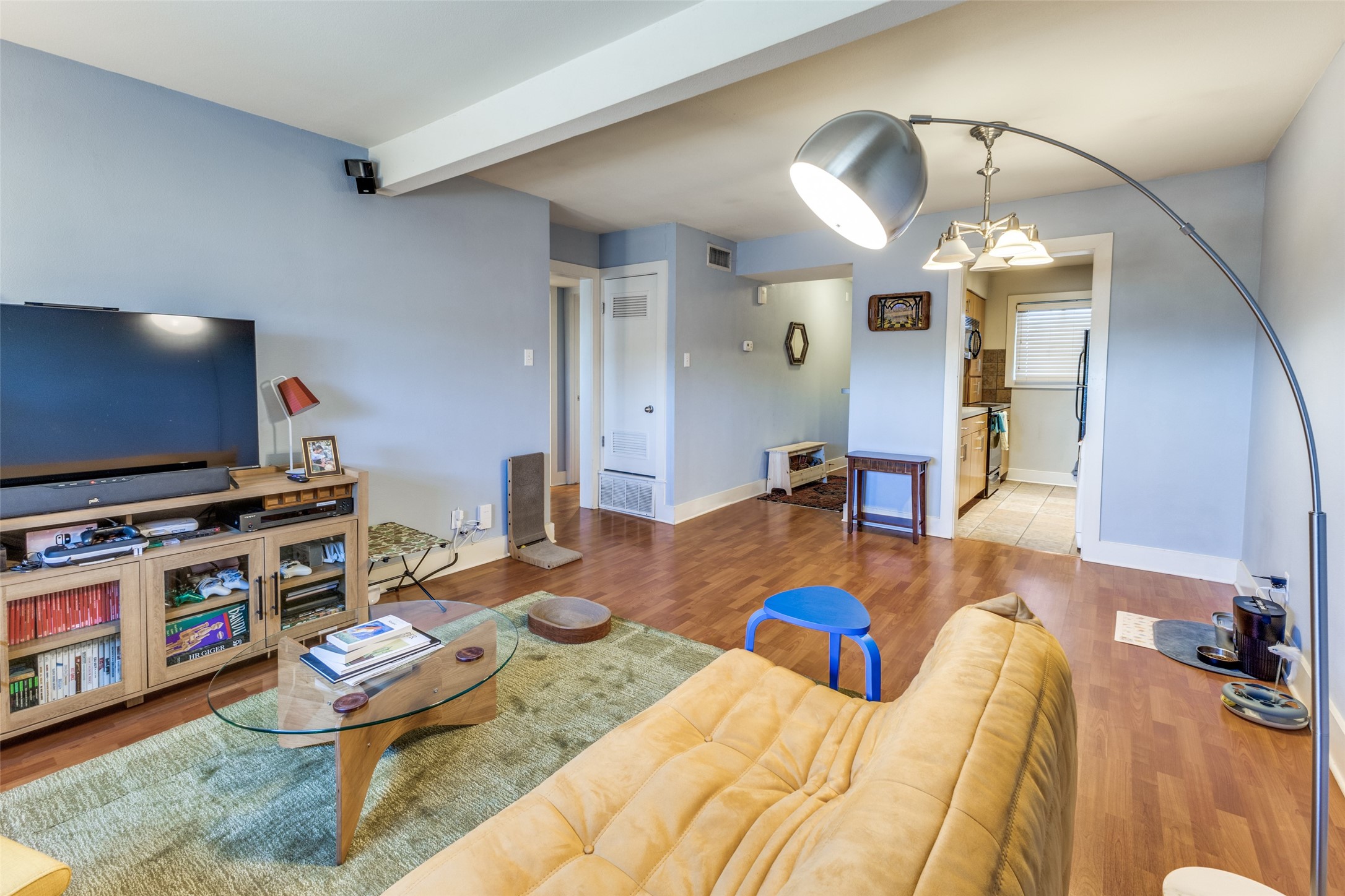 3815 Guadalupe Street, Unit 305 Austin, TX 78751 - Photo 6 of 27 a bedroom with a bed and a flat screen tv