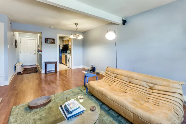 a bed room with a bed furniture and a wooden floor