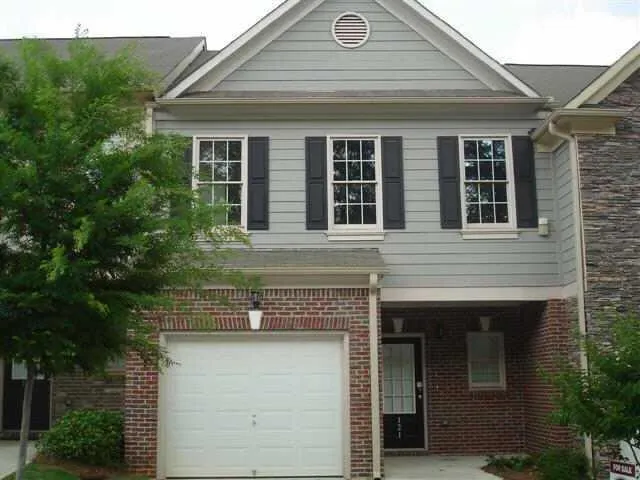 a front view of a house with a garage