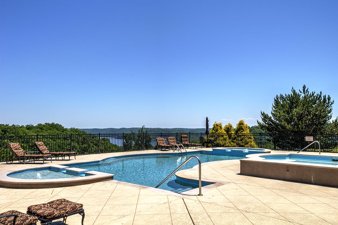 7100 Dale Ridge Road, Unit J3 Lancaster, TN 38569 - Photo 18 of 21 a swimming pool with outdoor seating and yard