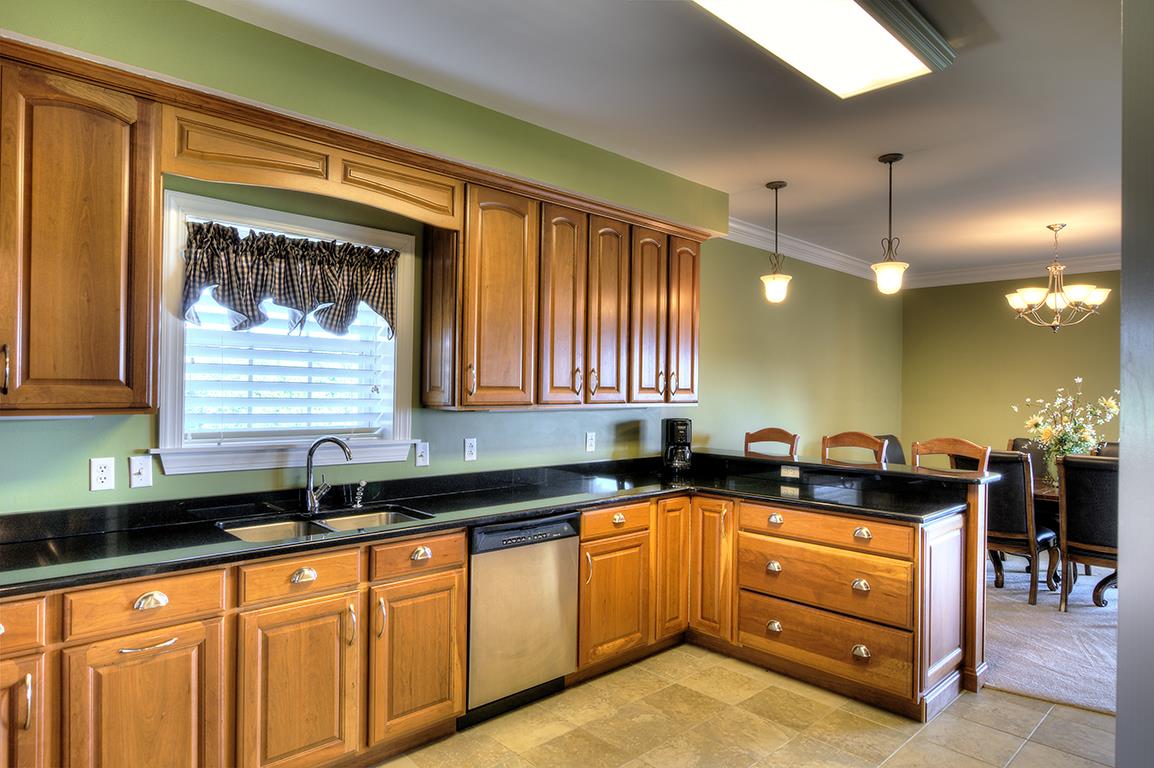 7100 Dale Ridge Road, Unit J3 Lancaster, TN 38569 - Photo 4 of 21 a kitchen with granite countertop a sink and cabinets