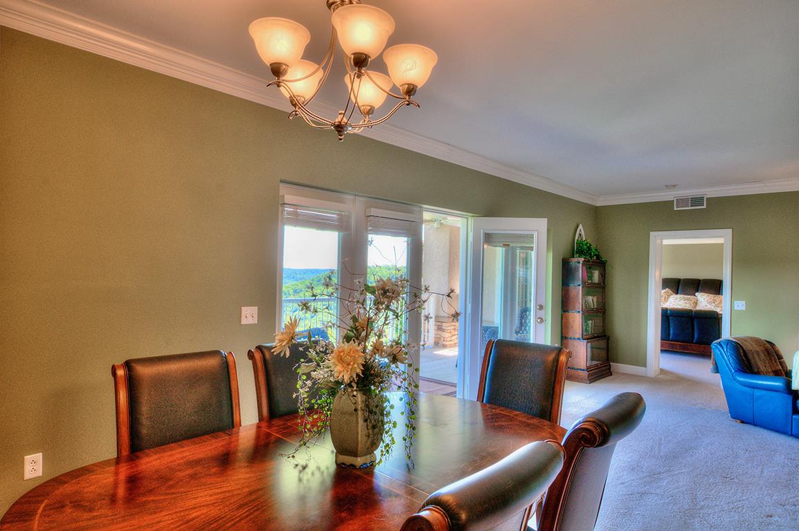 7100 Dale Ridge Road, Unit J3 Lancaster, TN 38569 - Photo 6 of 21 a view of a dining room with furniture wooden floor and chandelier
