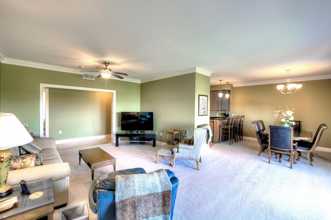 7100 Dale Ridge Road, Unit J3 Lancaster, TN 38569 - Photo 8 of 21 a living room with furniture and a flat screen tv