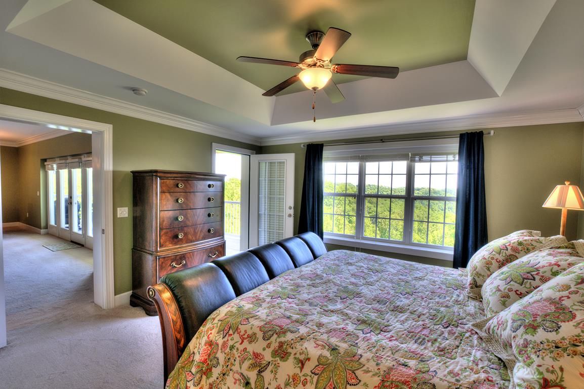 7100 Dale Ridge Road, Unit J3 Lancaster, TN 38569 - Photo 10 of 21 a bed sitting in a bedroom next to a window