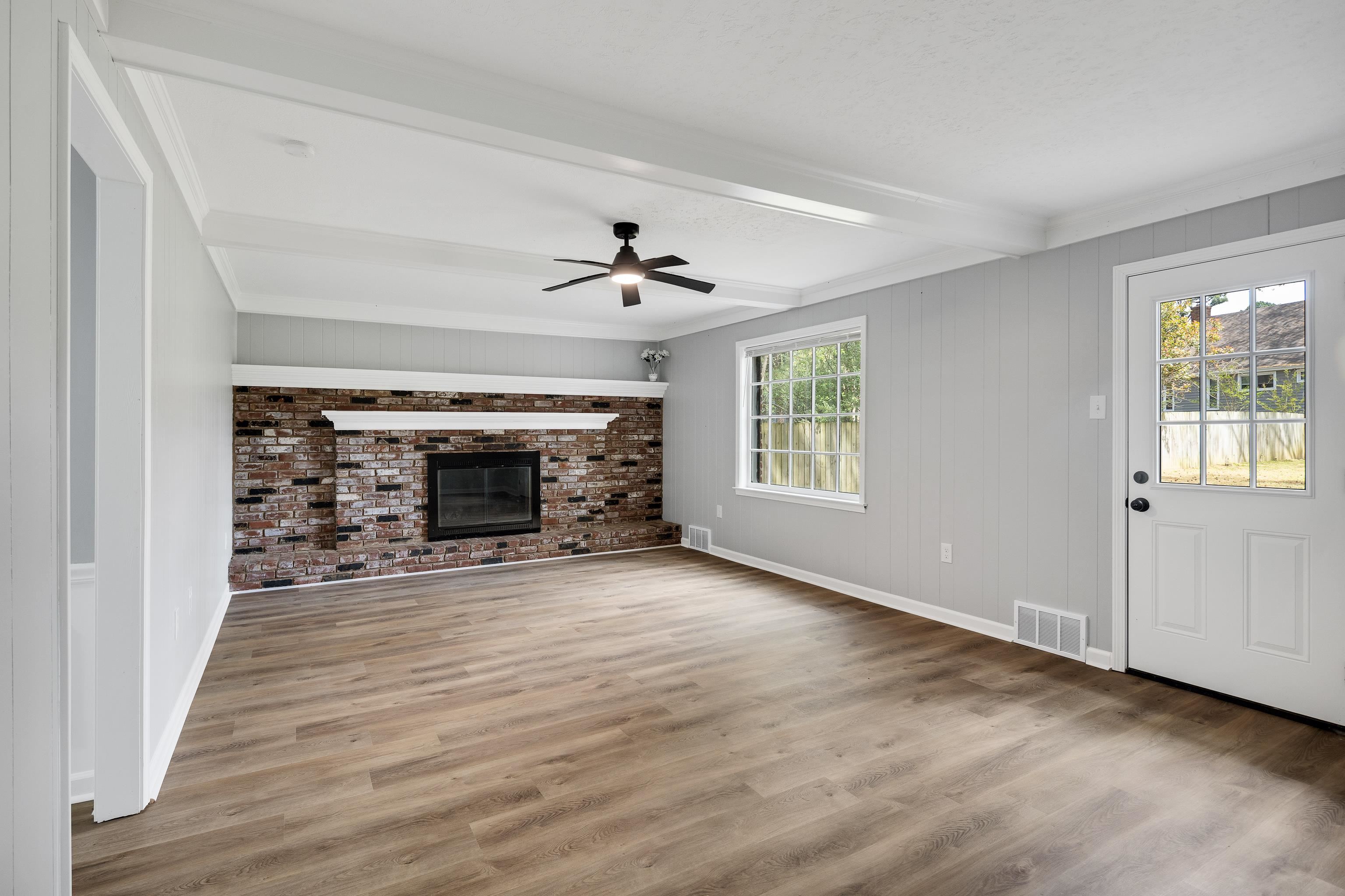 2096 Allenby Road Germantown, TN 38139 - Photo 11 of 40 wooden floor fireplace and windows in an empty room