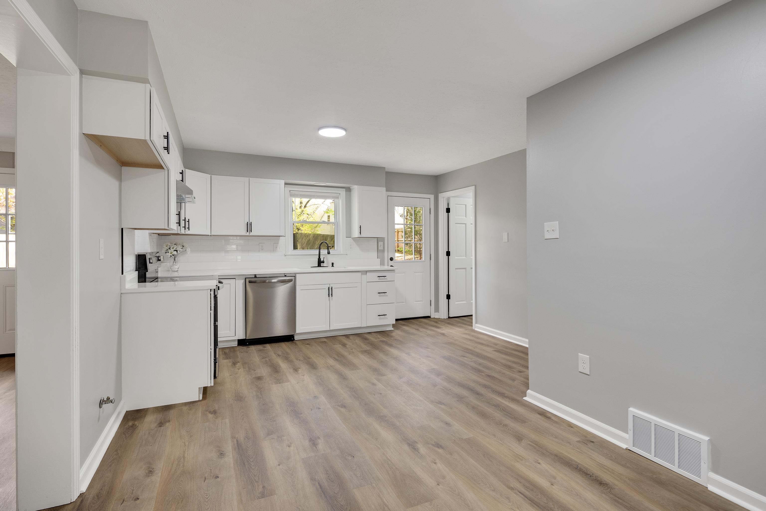 2096 Allenby Road Germantown, TN 38139 - Photo 15 of 40 a view of a kitchen with a sink wooden cabinets and window