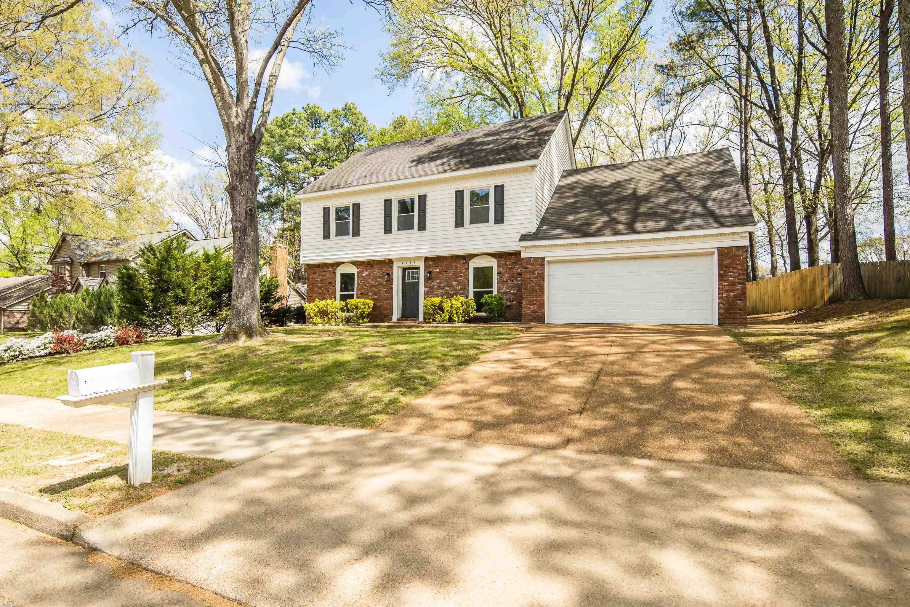 2096 Allenby Road Germantown, TN 38139 - Photo 2 of 40 a view of a house with snow on a yard