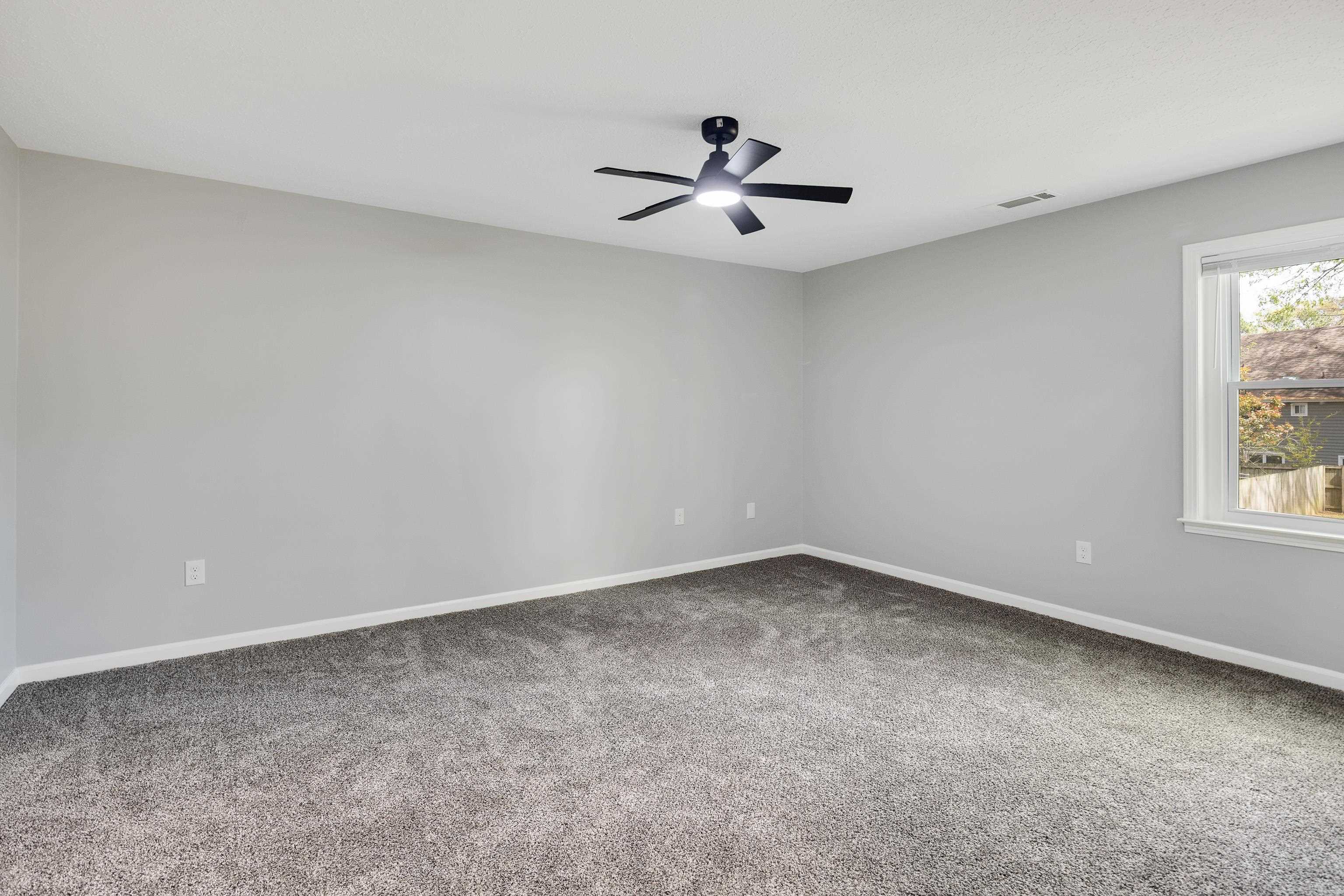 2096 Allenby Road Germantown, TN 38139 - Photo 27 of 40 an empty room with a window and a fan