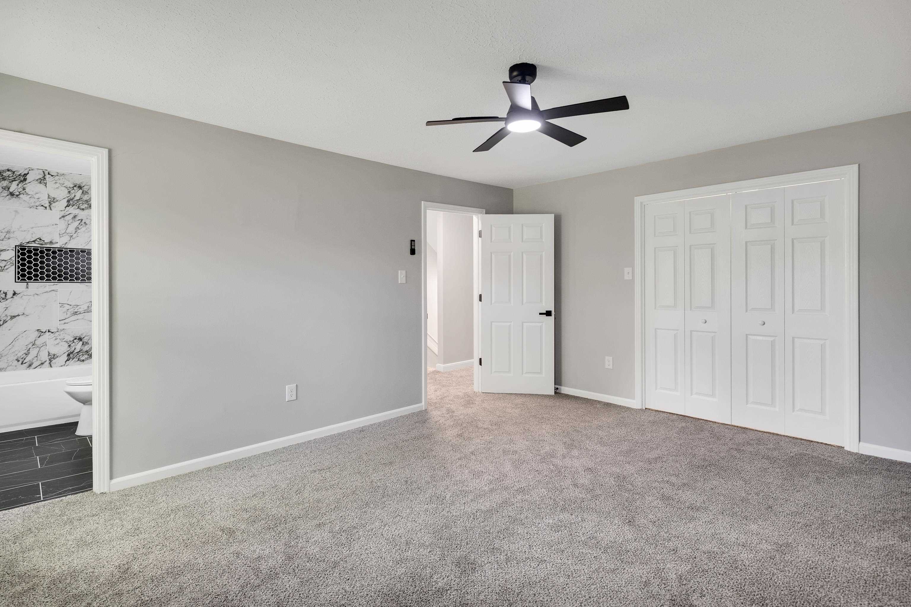 2096 Allenby Road Germantown, TN 38139 - Photo 28 of 40 a view of a livingroom and a ceiling fan