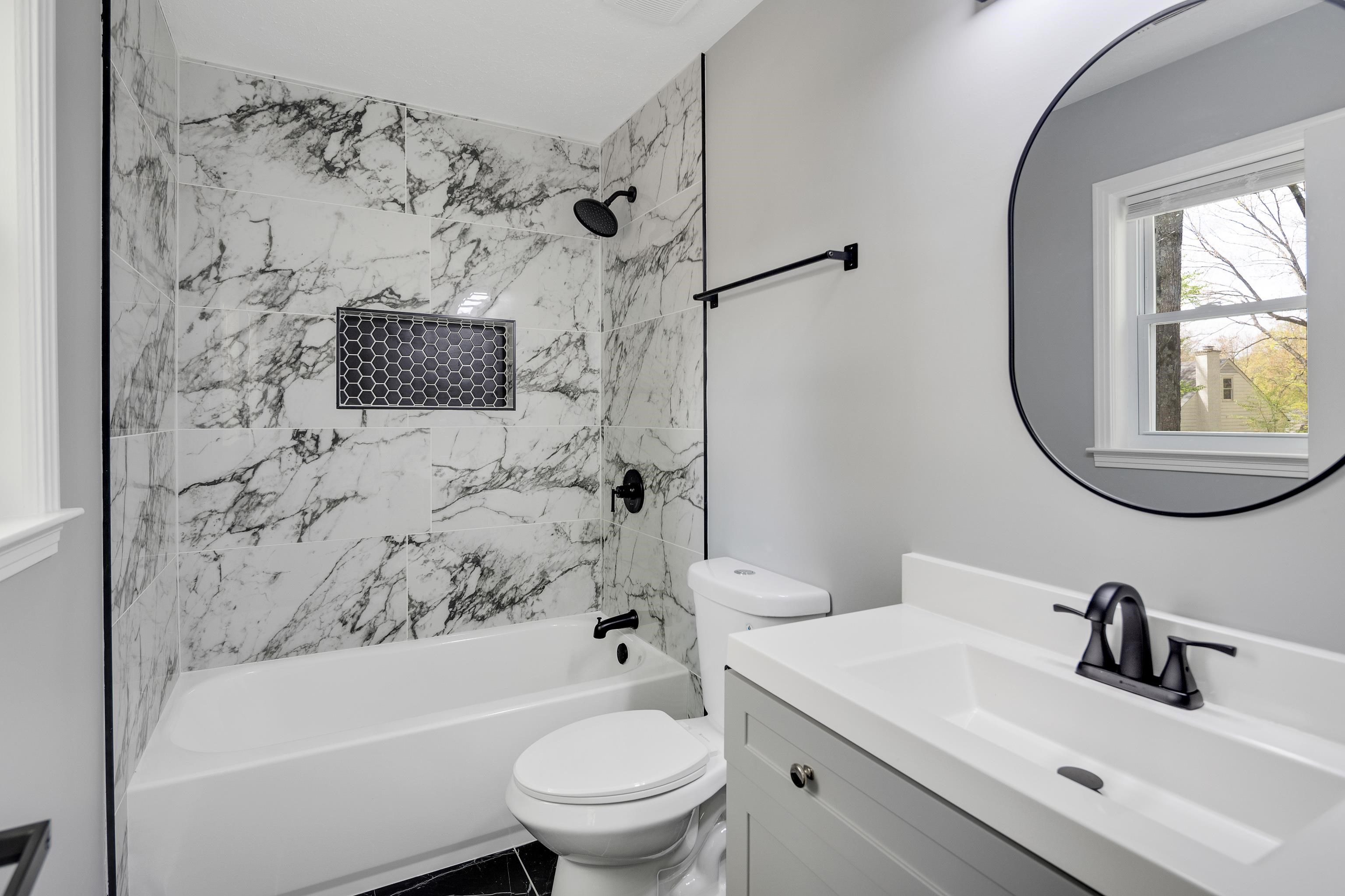 2096 Allenby Road Germantown, TN 38139 - Photo 29 of 40 a bathroom with a toilet sink vanity tub and shower