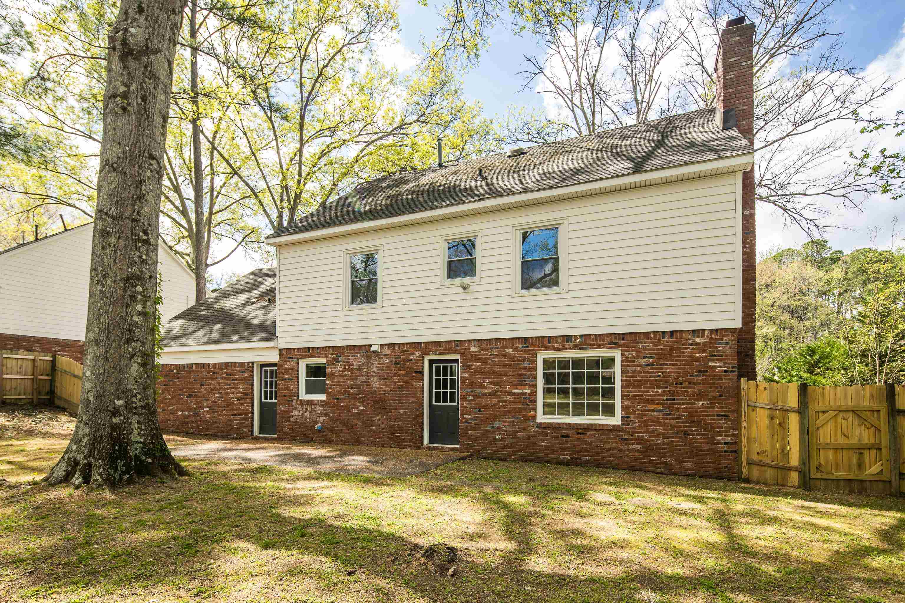 2096 Allenby Road Germantown, TN 38139 - Photo 38 of 40 a view of a backyard with a large tree