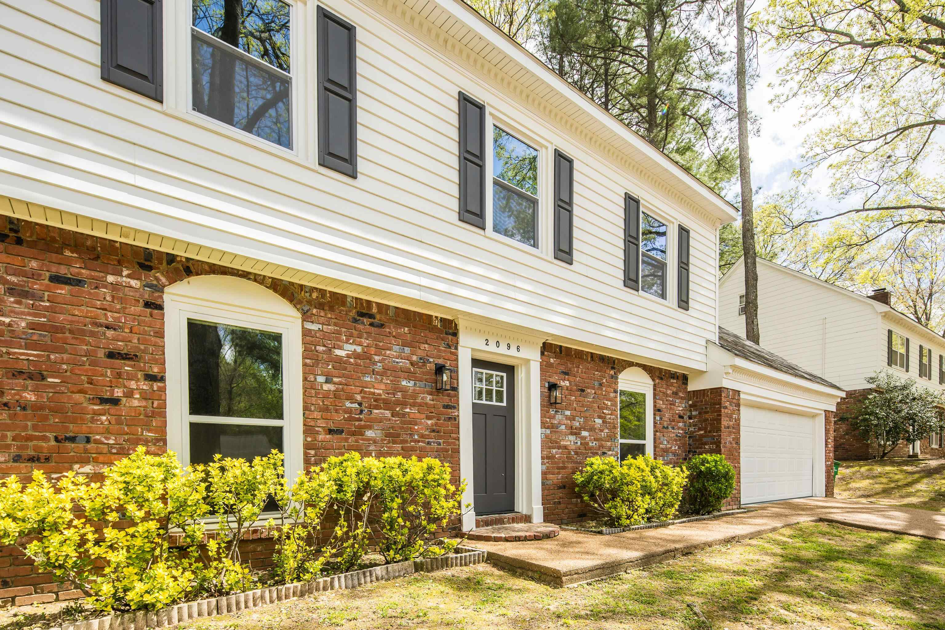 2096 Allenby Road Germantown, TN 38139 - Photo 4 of 40 a view of a house with potted plants and a table and chairs