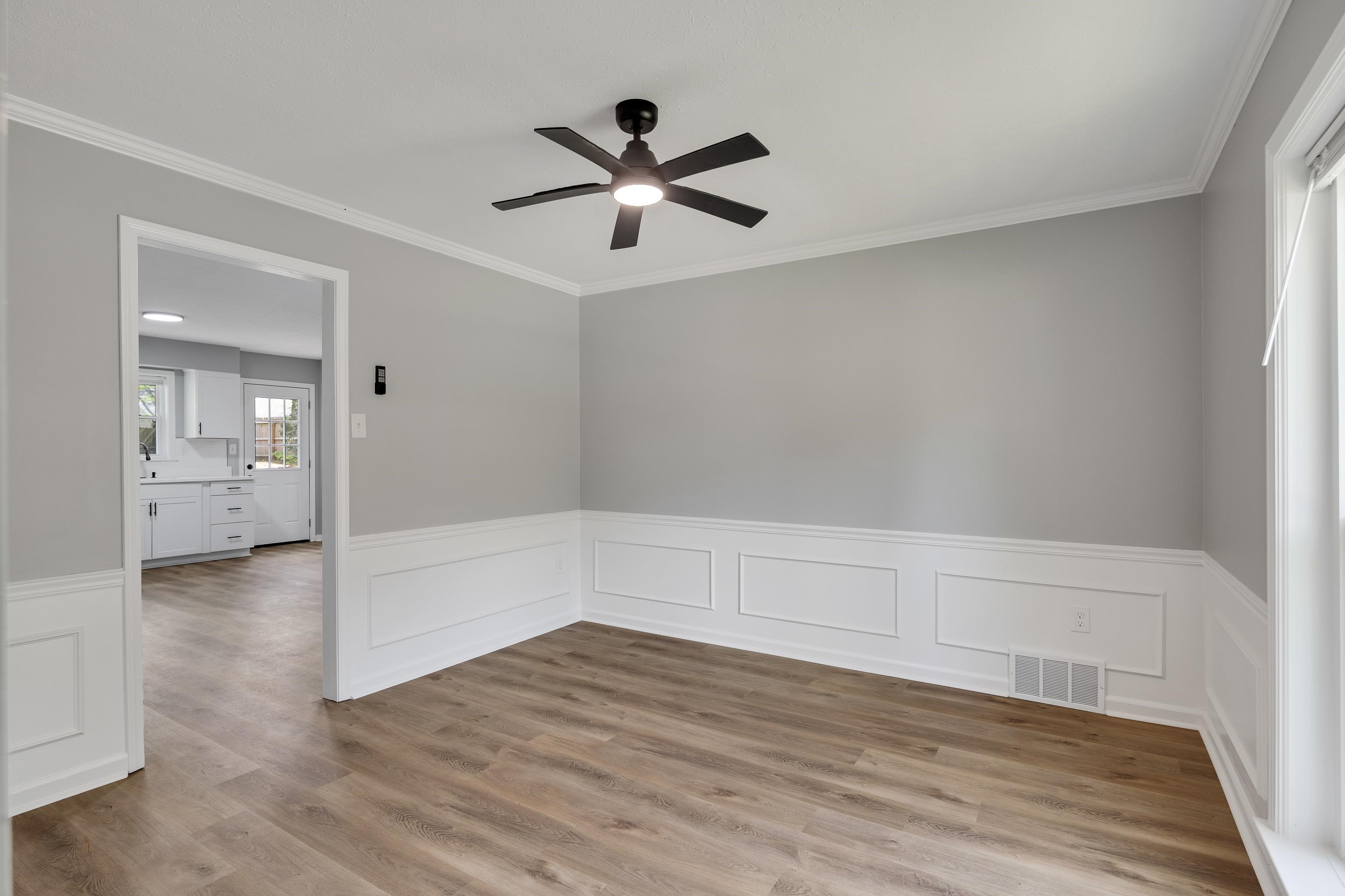 2096 Allenby Road Germantown, TN 38139 - Photo 9 of 40 an empty room with wooden floor and windows
