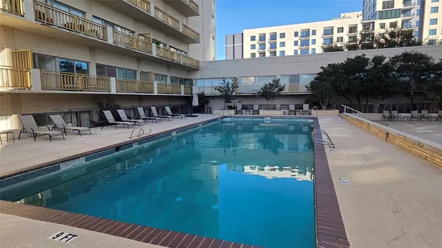 a view of a patio with a table and chairs