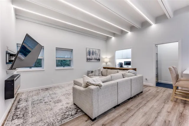 a kitchen with a sink appliances and cabinets