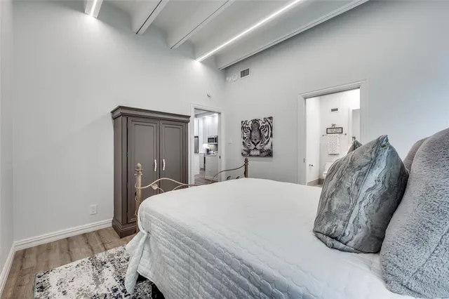 a bedroom with a bed and a table in it