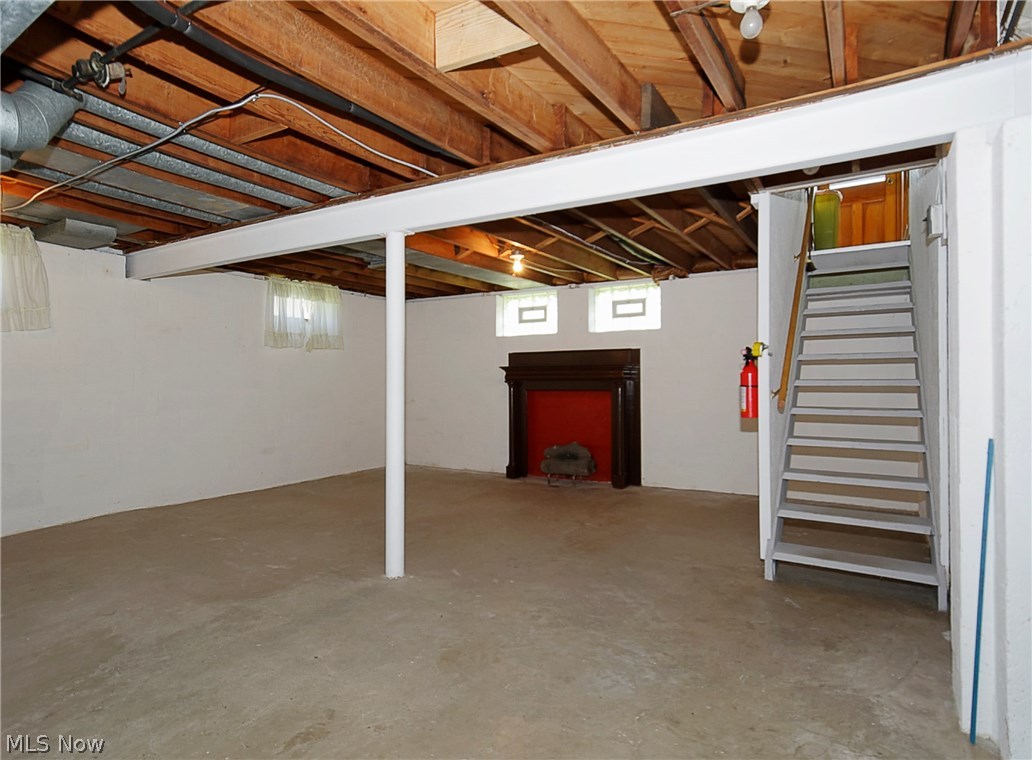 14077 Alexander Road Bedford, OH 44146 - Photo 14 of 31 Full basement with decorative fireplace.