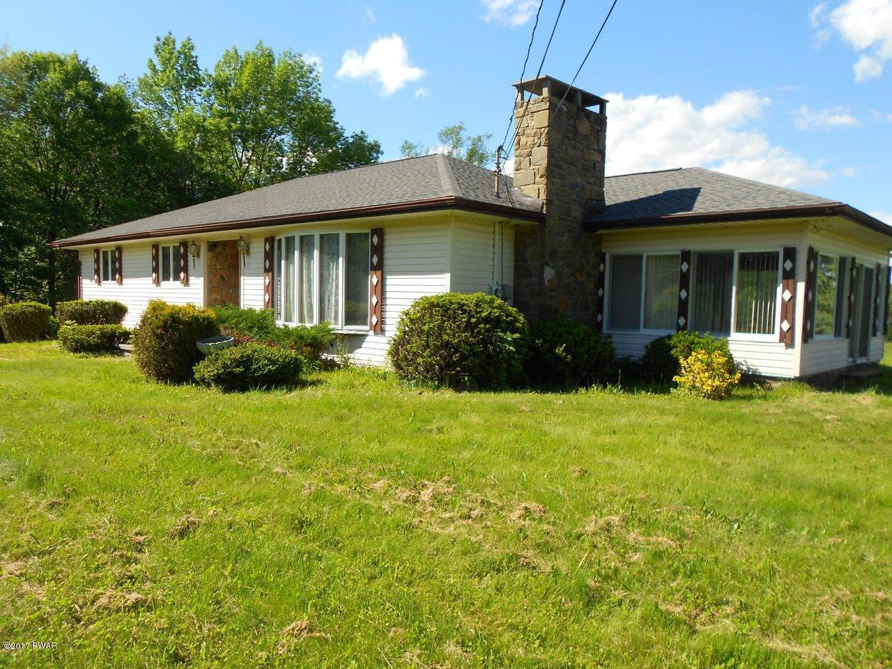 369 Roemerville Road Greentown, PA 18426 - Photo 11 of 45 a front view of a house with garden