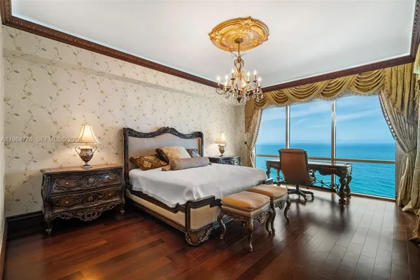 a view of walk in closet with wooden floor