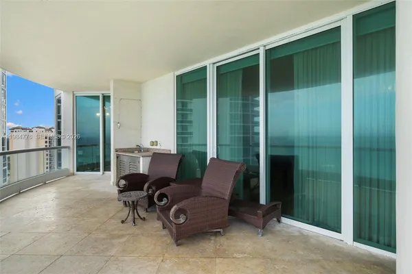 a bedroom with a bed and glass top table