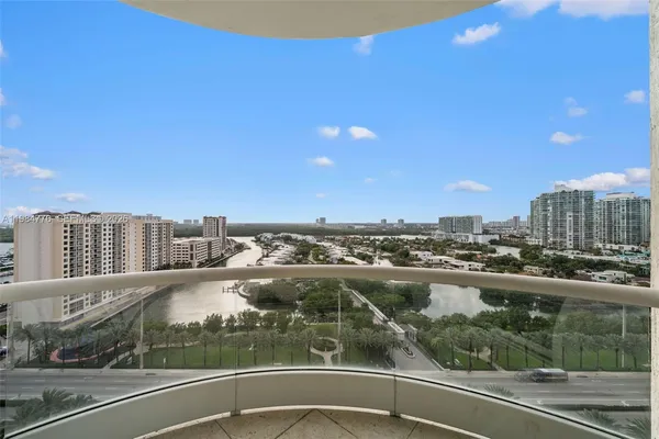 a view of swimming pool with outdoor seating and house in the background