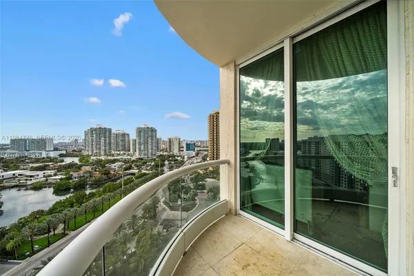 a view of a swimming pool with outdoor seating