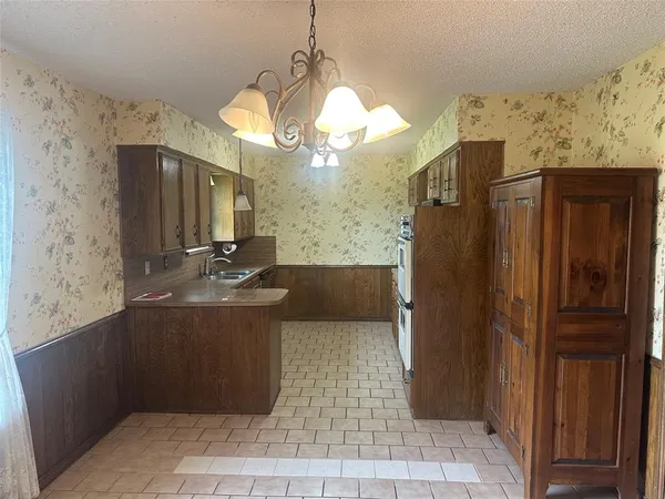 a bathroom with a sink a large mirror and a shower