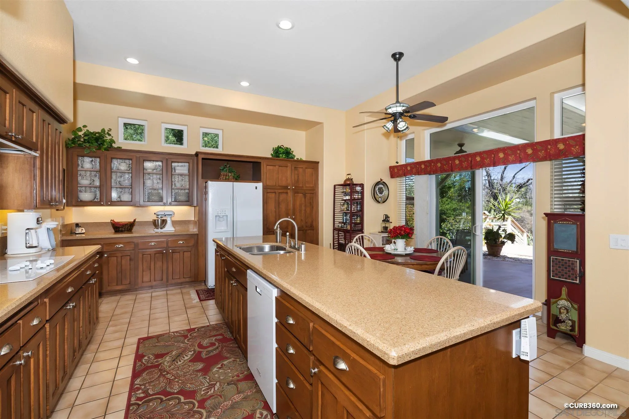 2520 Tompau Place Alpine, CA 91901 - Photo 11 of 41 a kitchen that has a lot of cabinets in it