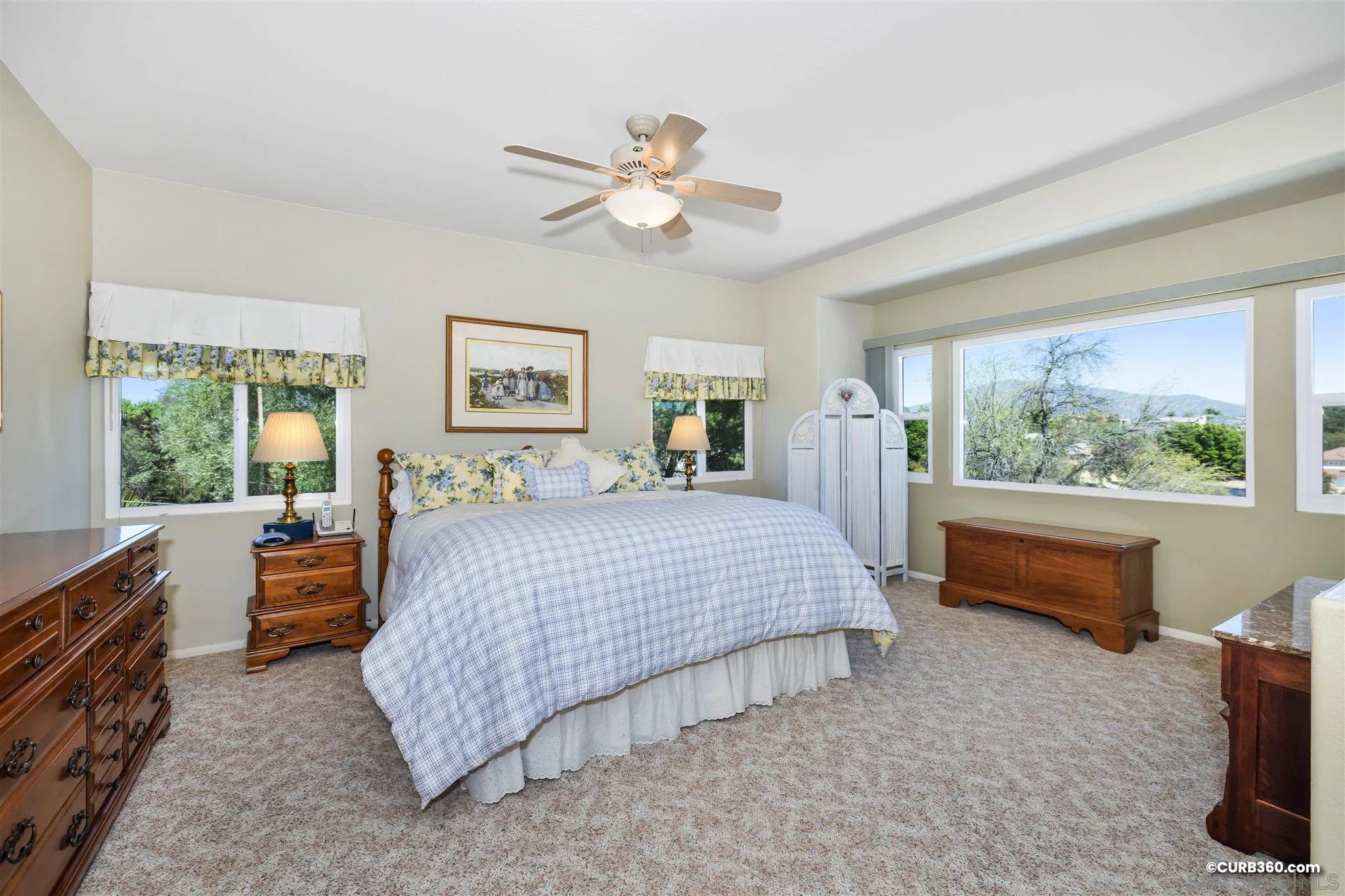 2520 Tompau Place Alpine, CA 91901 - Photo 22 of 41 a bedroom with a bed and a chandelier