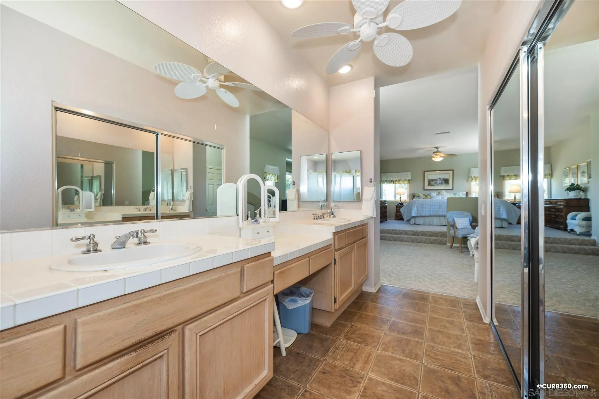 2520 Tompau Place Alpine, CA 91901 - Photo 27 of 41 a bathroom with a double vanity sink and a mirror
