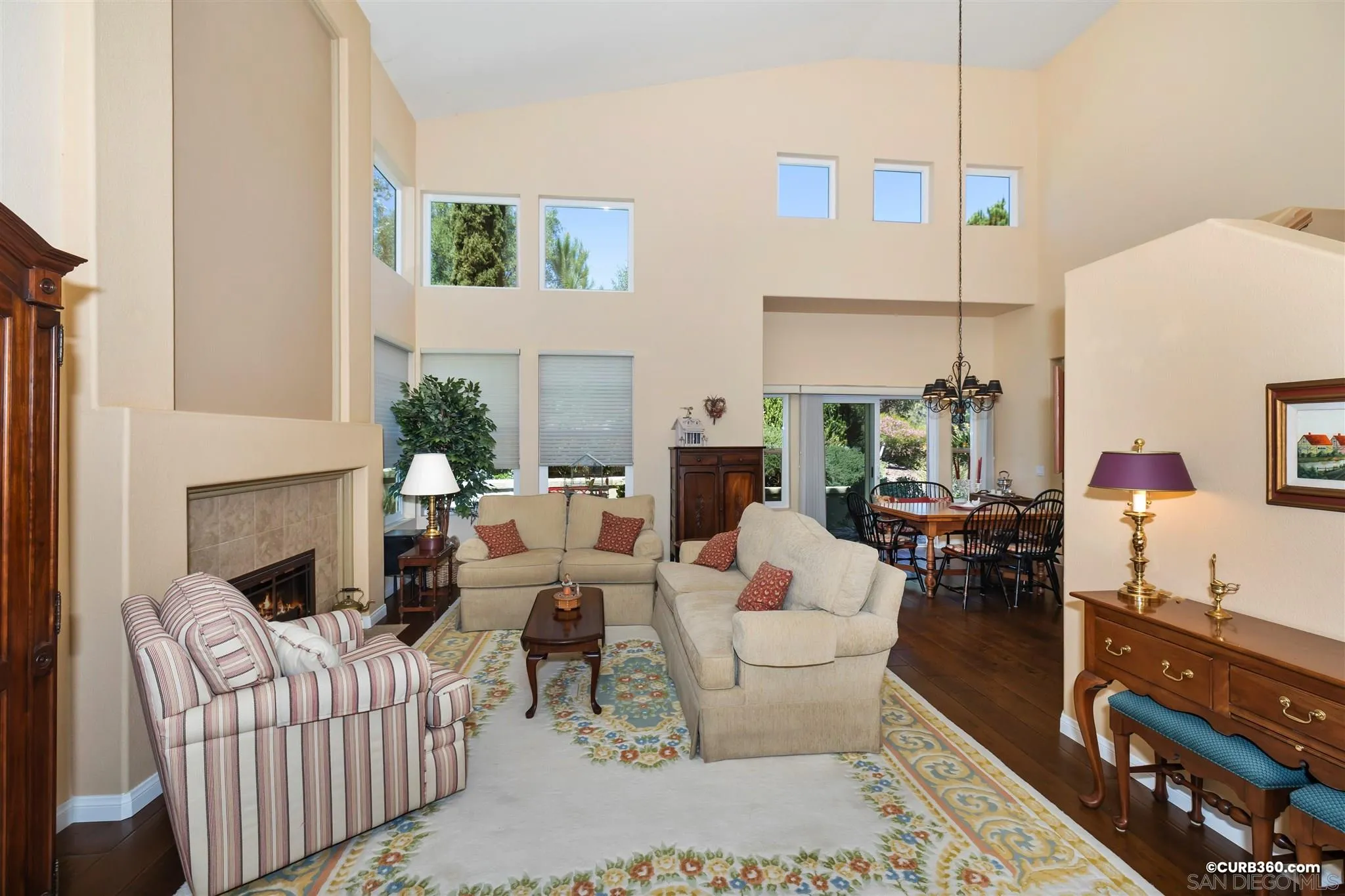 2520 Tompau Place Alpine, CA 91901 - Photo 8 of 41 a living room with furniture a fireplace and a table