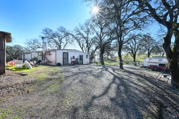 a view of a field with of house